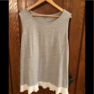 Sleeveless sweater knit with woven piecing detail